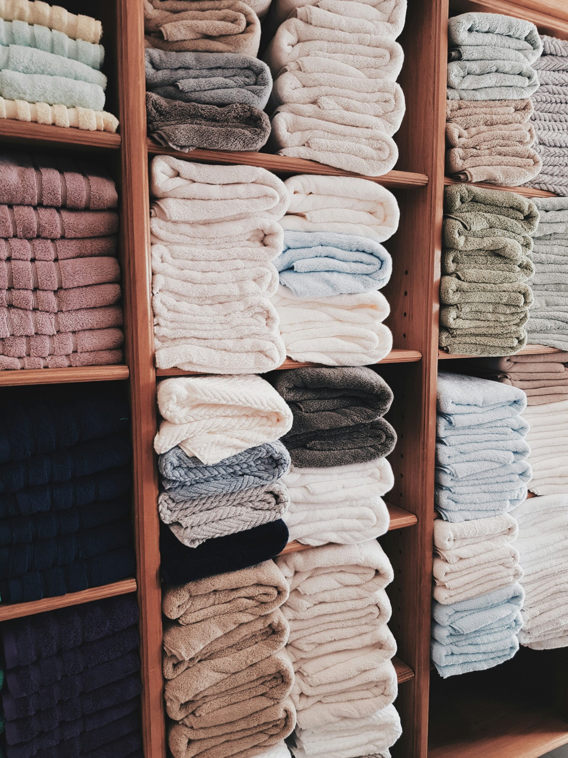 Picture of stacks of towels in different muted colors